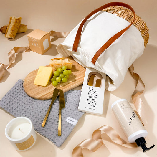 new-home-gift-in-basket-bag-with-arched-board-and-waffle-tea-towel-with-candle