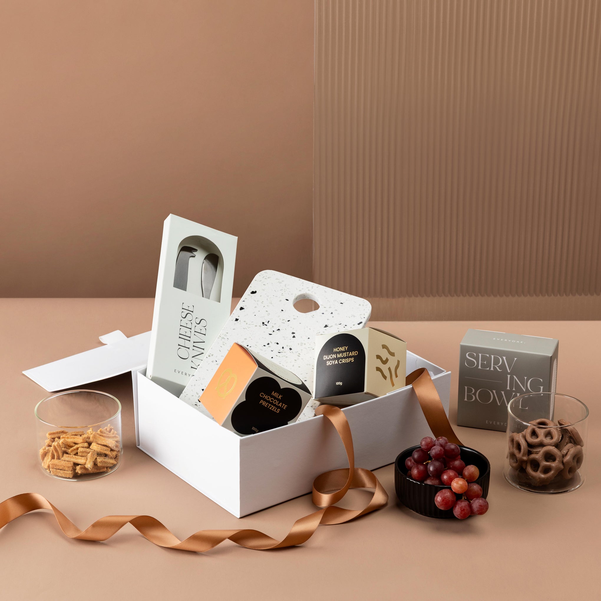 style-bundle-gifts-for-new-homeowners-terrazzo-and-treats-with-cheese-knives-and-snacks