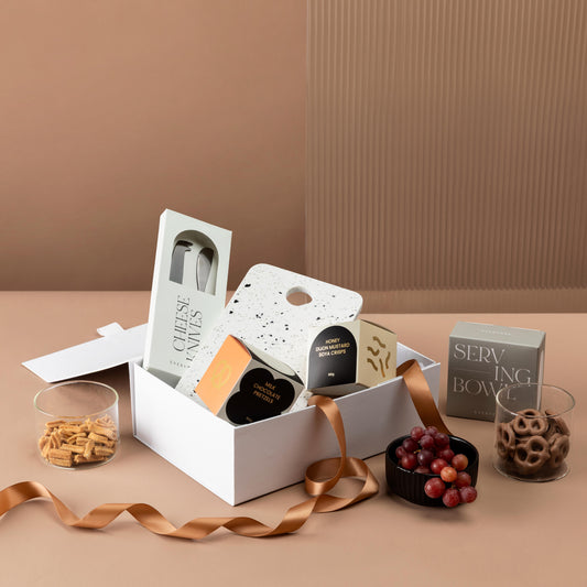 style-bundle-gifts-for-new-homeowners-terrazzo-and-treats-with-cheese-knives-and-snacks