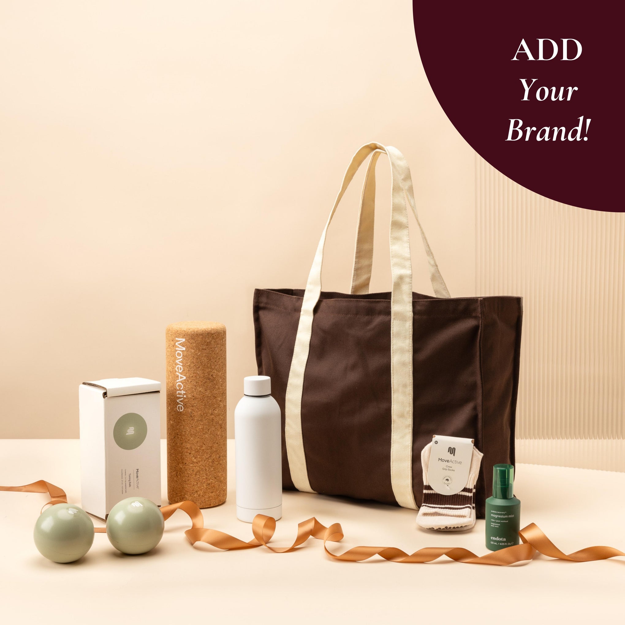 style-bundle-wellness-hamper-in-chocolate-tote-bag-with-move-active-weighted-balls-and-brand-the-drink-bottle