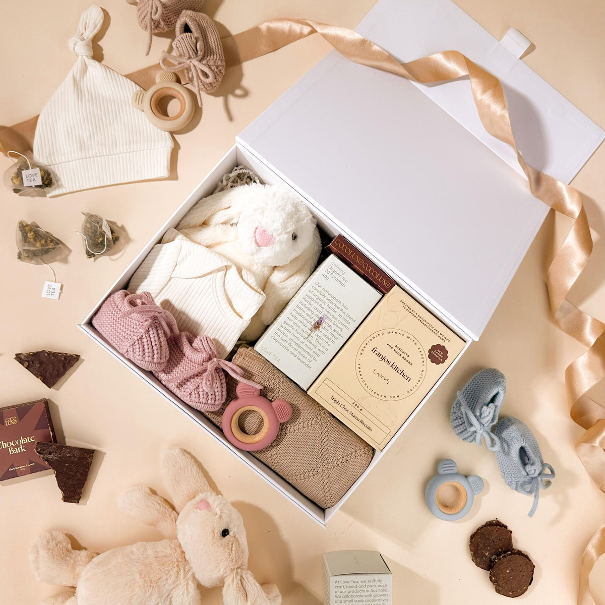 newborn-gifts-for-baby-girl-with-pink-teether-and-booties-and-boob-biscuits-for-mum-in-gift-box
