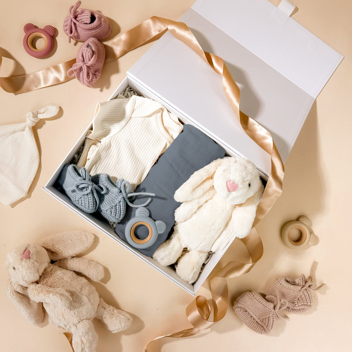 new-baby-gift-for-boys-with-plush-bunny-toy-and-blue-knit-booties-in-gift-box