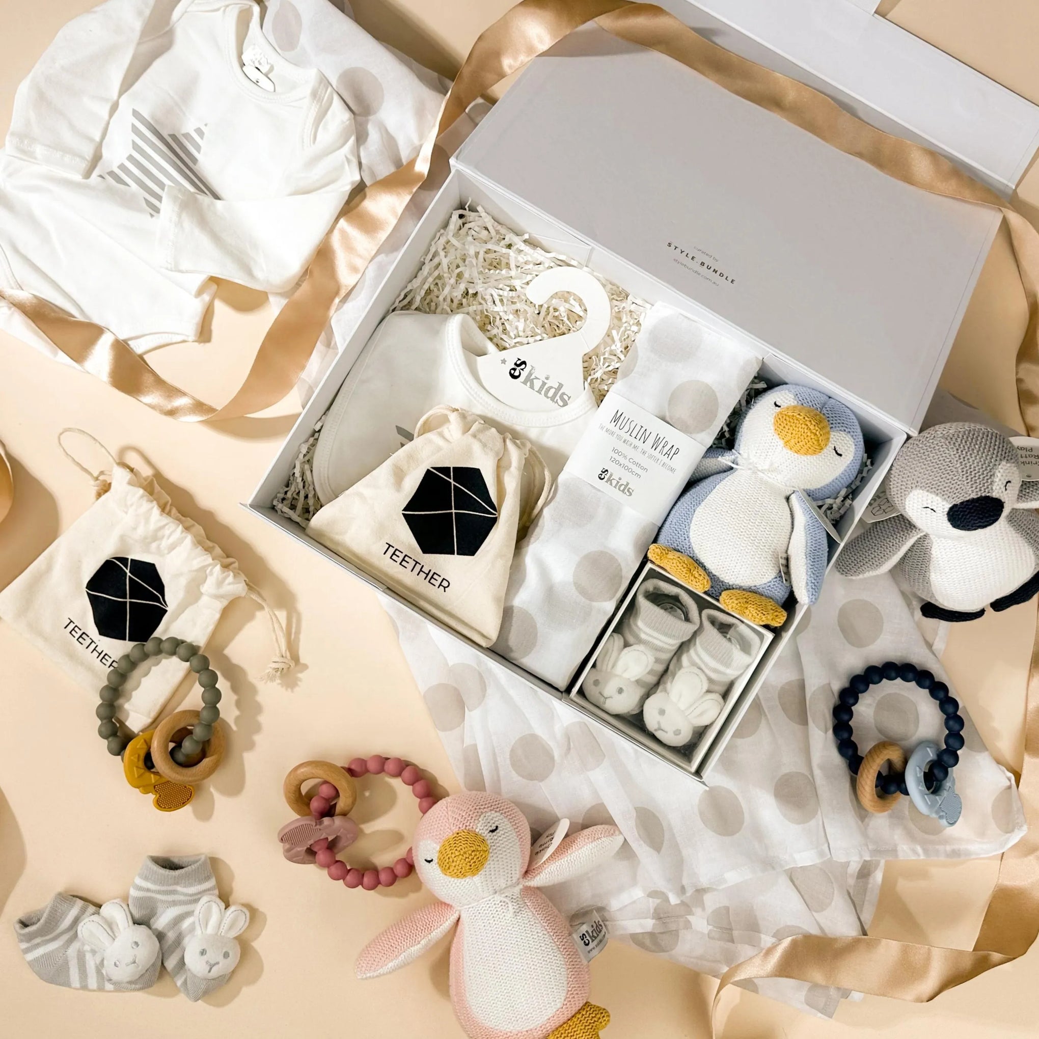 style-bundle-thoughtful-newborn-gift-hamper-with-muslin-wrap-and-penguin-toy-with-silicone-teether