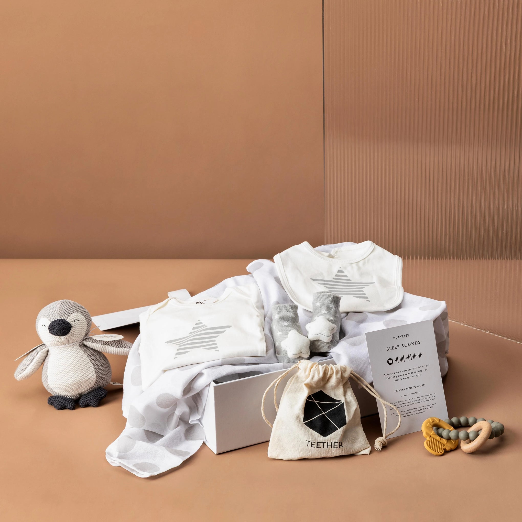 style-bundle-newborn-gift-hamper-the-new-arrival-with-muslin-wrap-and-baby-toy-and-teether-for-new-parents-and-baby