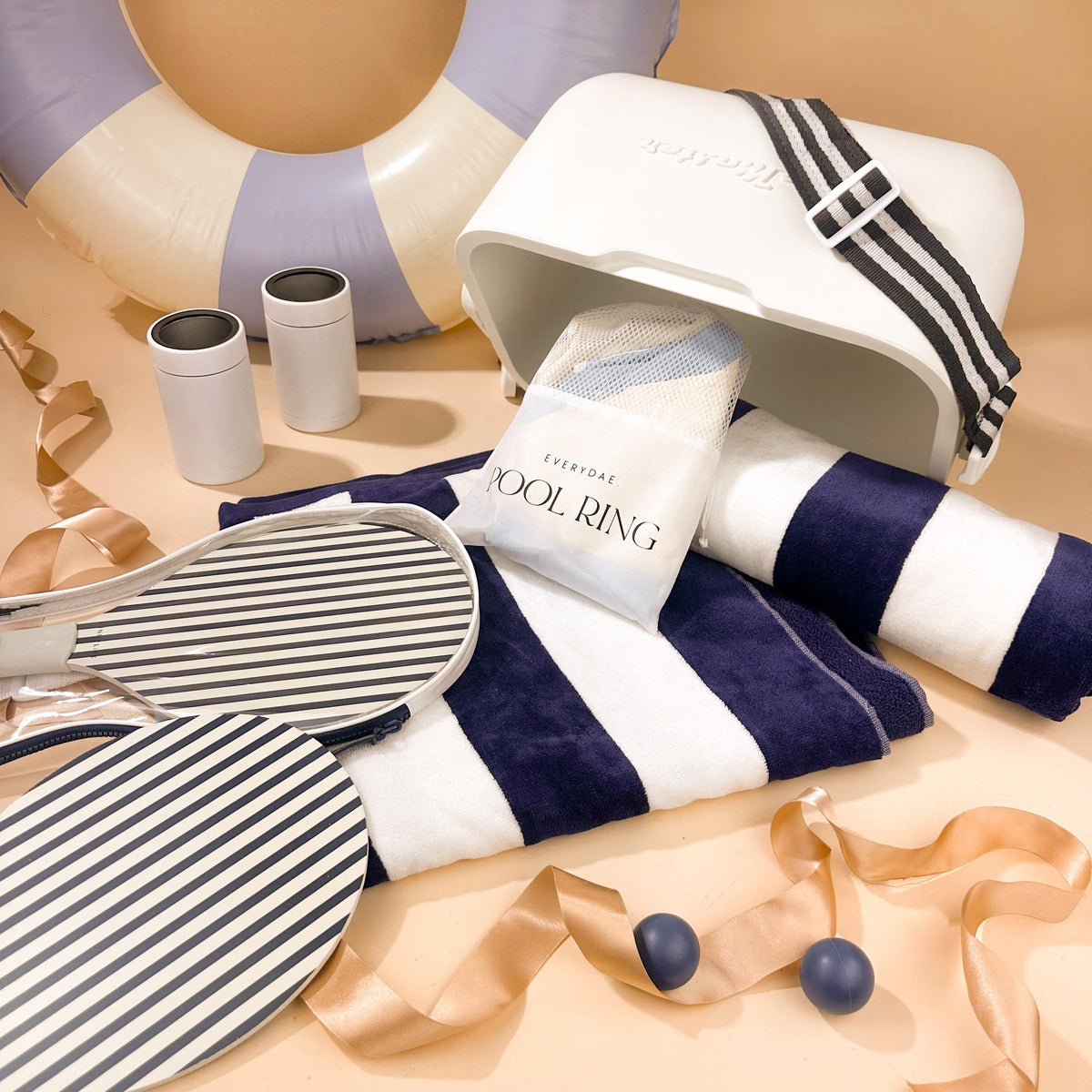 playful-practical-summer-gift-with-esky-and-pool-ring-with-striped-velour-towels-and-paddle-game