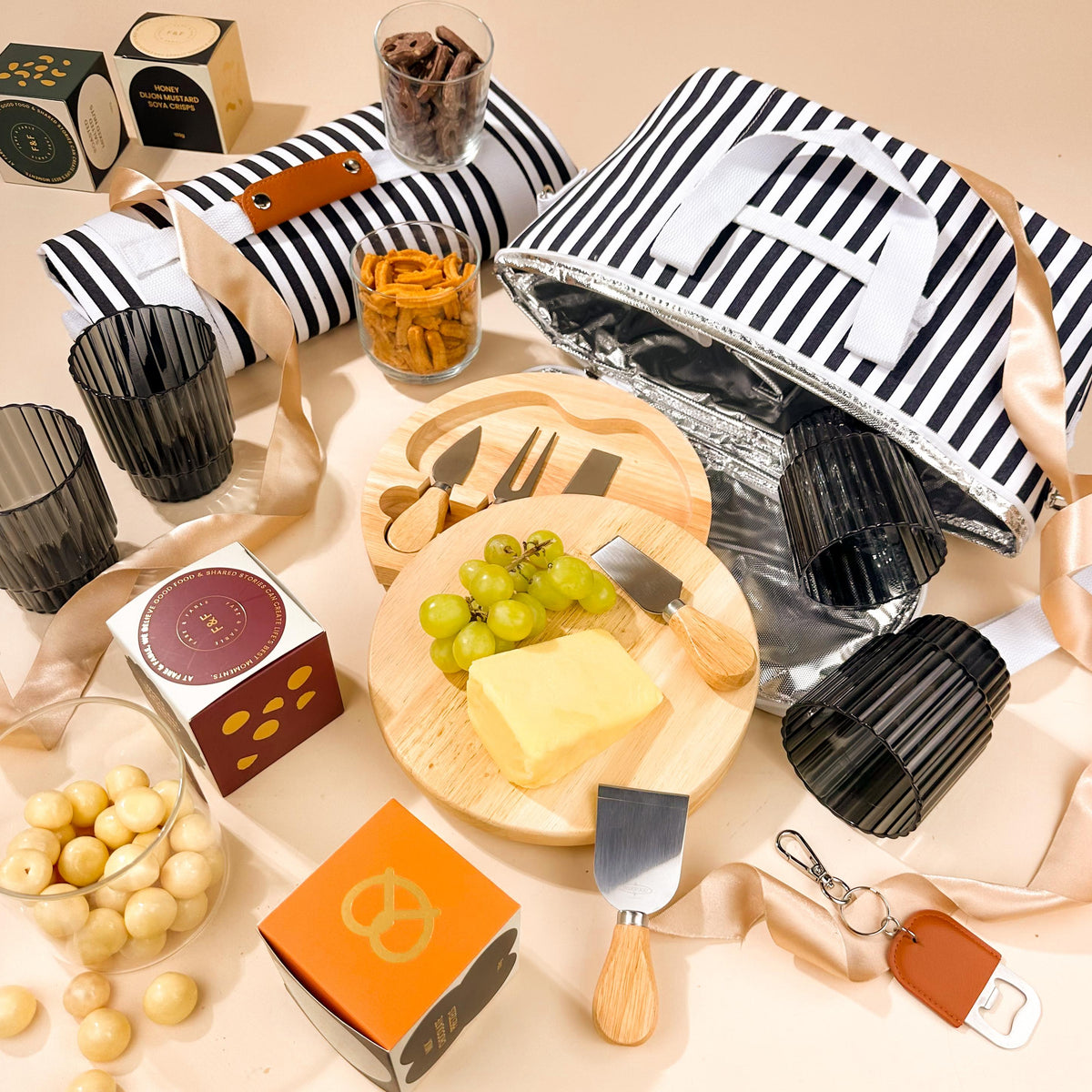 corporate-picnic-hamper-with-insulated-cooler-bag-and-cheese-board-with-knives-and-snacks