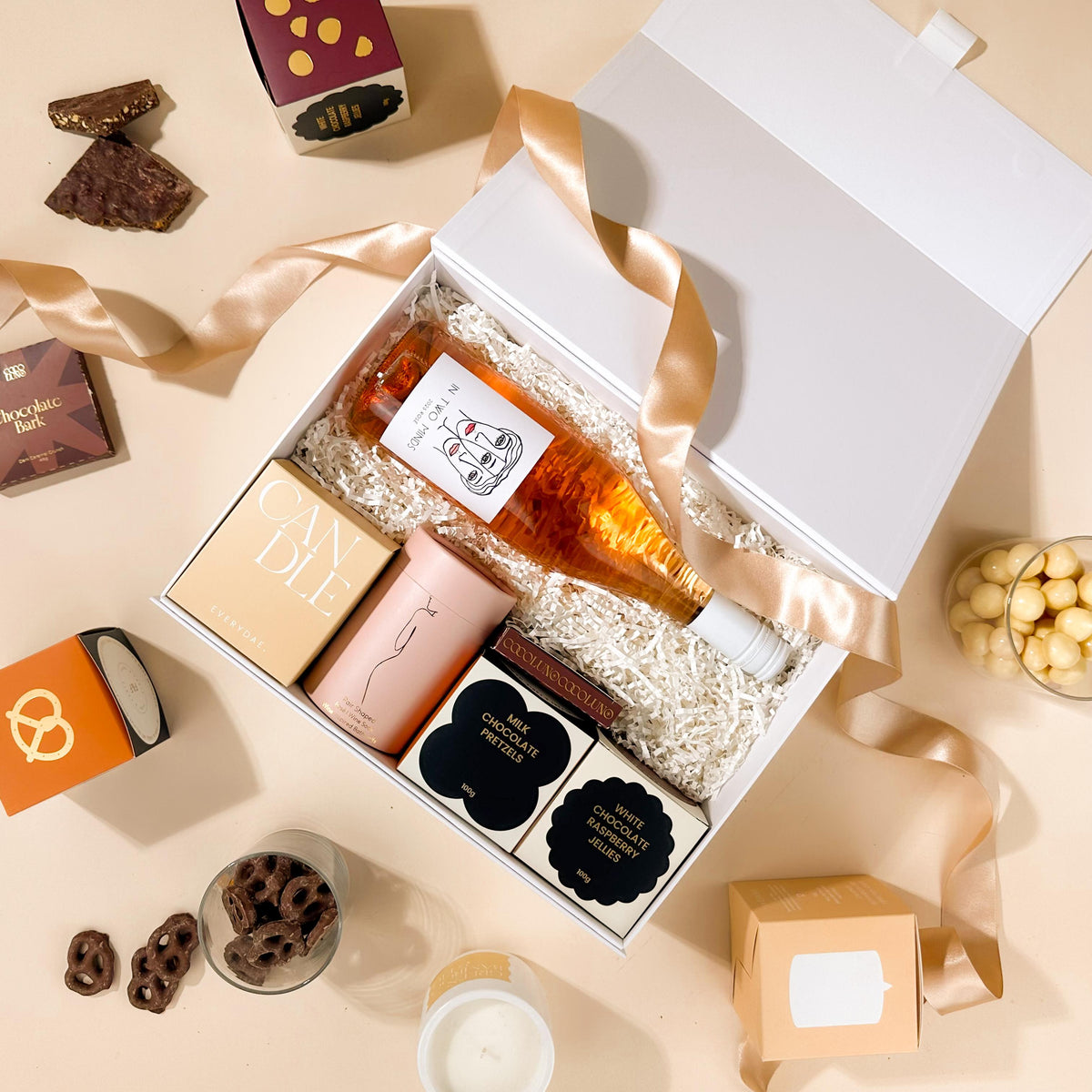 self-care-hamper-with-chocolate-and-bath-salts-and-rose-wine-in-a-gift-box